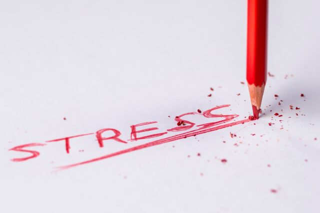 A red pencil writes the word, "Stress."