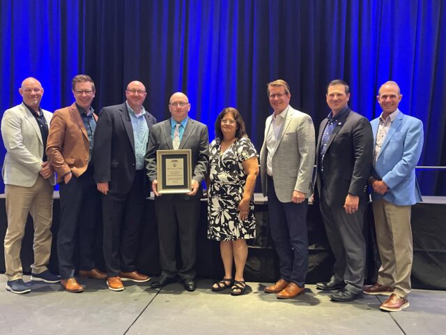 Director of Safety Isaac Harmon, Vice President of Canadian Operations Matt Carr, Midwest Division Manager Richard Jones, Stuart Shuck, Barbara Shuck, CEO Duane Trower, Chief Operating Officer Dan Most, and President John Bickel Jr.
