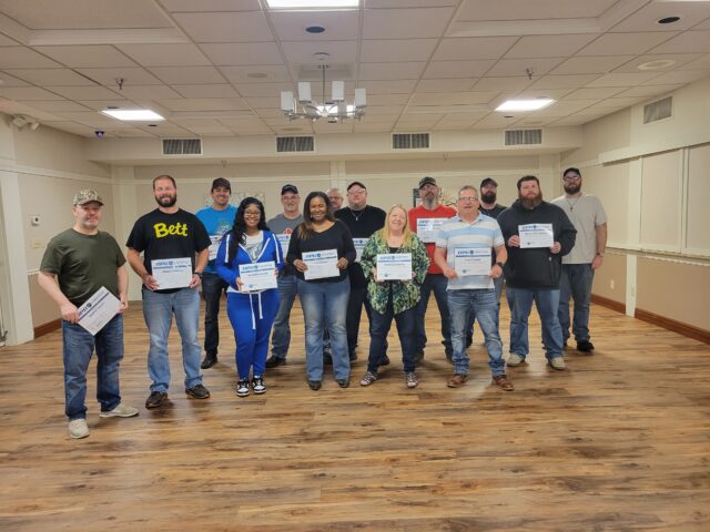 From left: Drago Gojic, Brian Farrell, Zack Dowdal, Raynika Adams, John Guerdet, Lisa Welsh, Jeff Mills, Dustin Swearinger, Theresa Mastin, Chris Songer, Greg Lange, Chris Mcadoo, Nick Cregan, and Seth Grafton