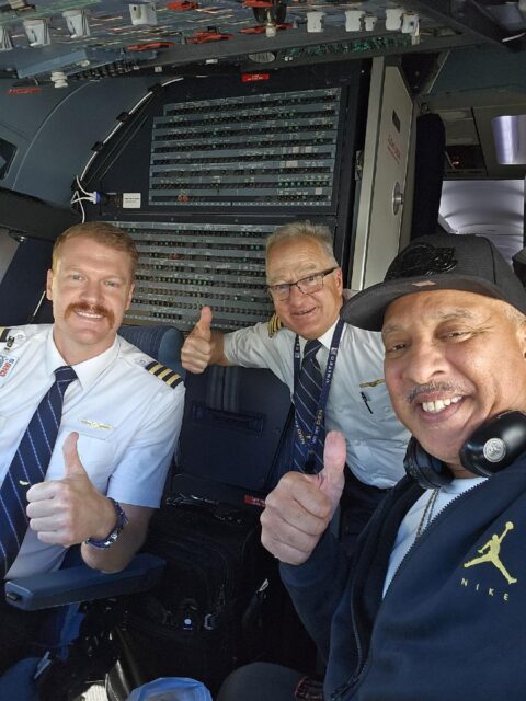 Ed Bryant (front) poses with two airline pilots.