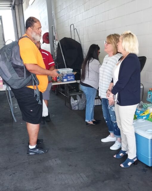 Driver Vincent Birk pauses to chat with Regional Recruiter Trina Weiher and Sales Manager Jennifer Ripley.