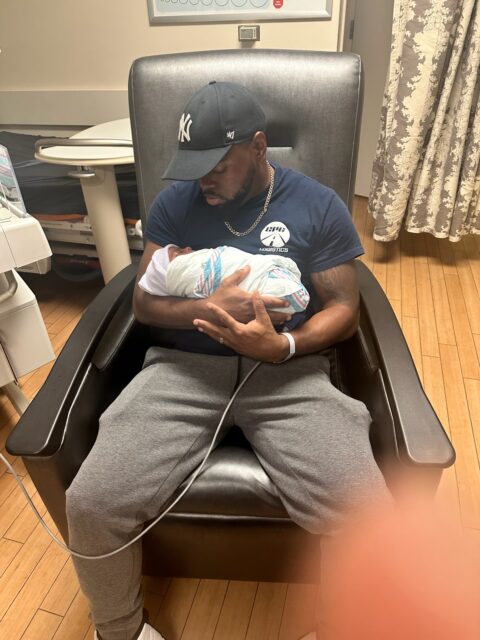 Jamarcus Reagon holds his newborn son, Jalen.