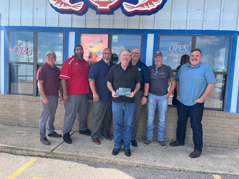 From left: Operations Manager Luke Lenius, Safety Supervisor Gary Simon, Regional Manager Rick Weiher, Division Manager Richard Jones, colleague Brian Webb and Walgreens Area Manager of Logistics Lew Hoffman