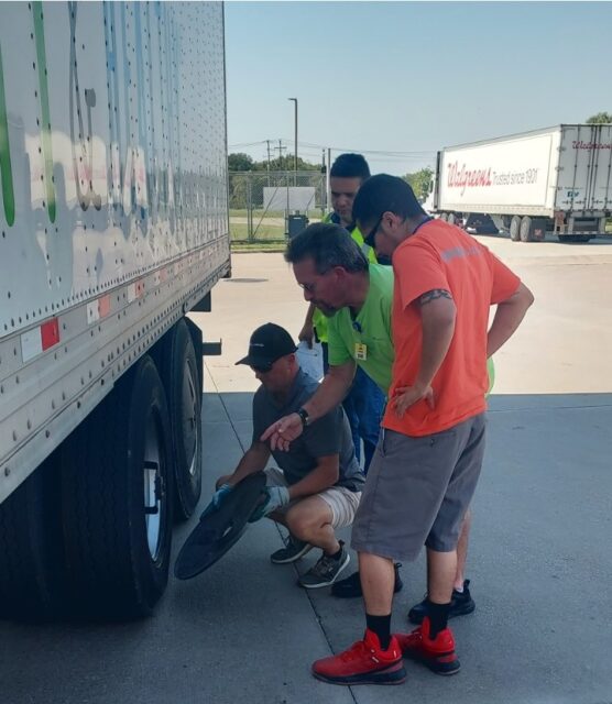 Safety Manager John Schlichter advises a group of drivers.