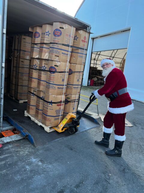 Tim McLeod loads wreaths onto a truck