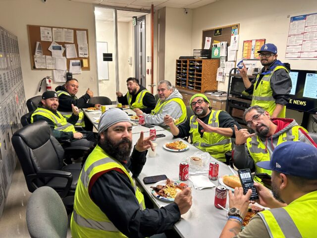 Truck drivers enjoy sandwiches