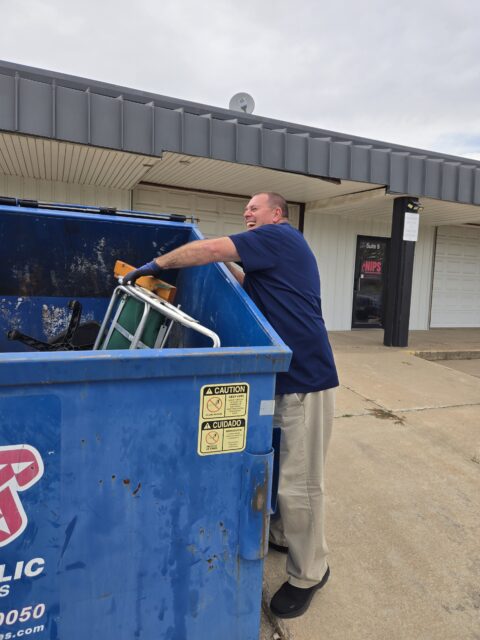 Kevin Adams fishes for a chair for his boss, Richard Jones
