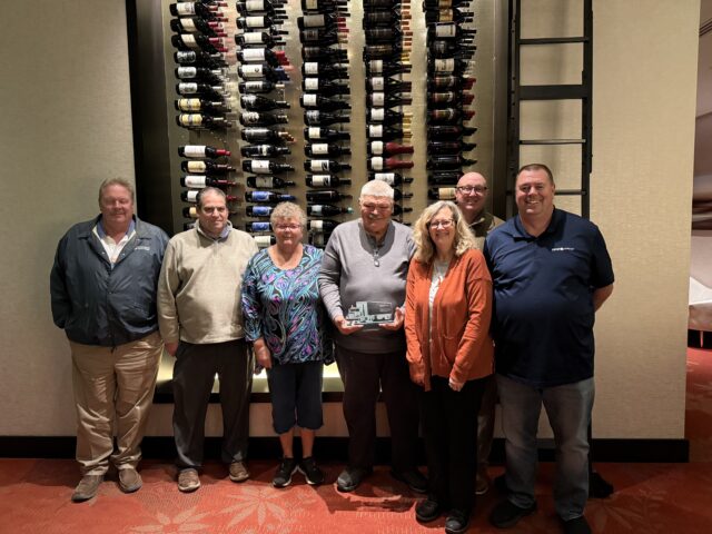 From left: former CPC Regional Manager John Fitzgerald, Dispatcher Scott Thede, George’s wife Suzan, George, Dispatcher Barb Francis-Blanchard, Division Manager Richard Jones and Regional Manager Kevin Adams