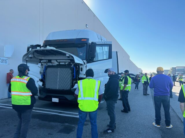 Drivers watch the presentation about the new equipment.